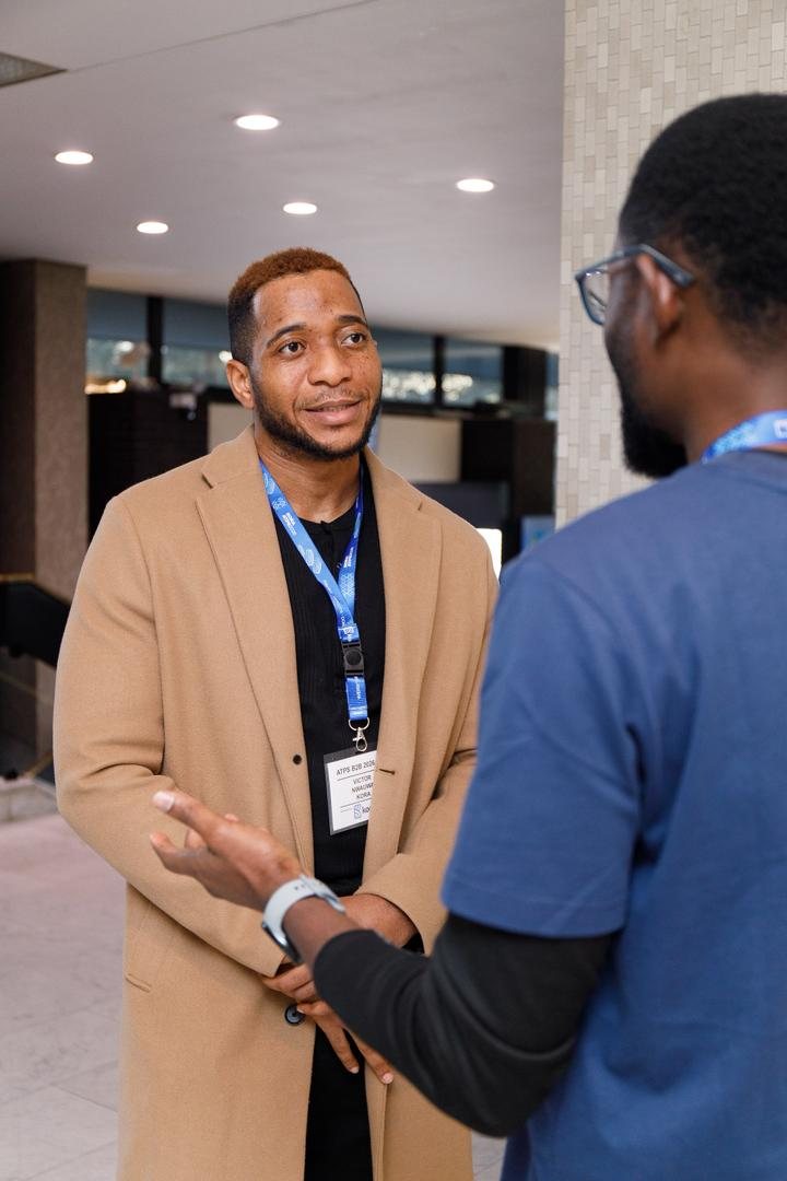 Victor Nwauwa in conversation with a delegate at ATPS B2B 2026